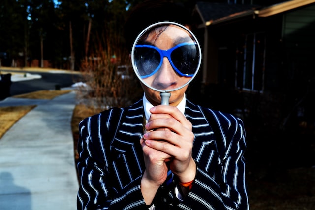 Magnifying glass in front of a person's face