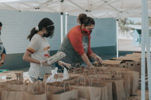 volunteers placing food in bags